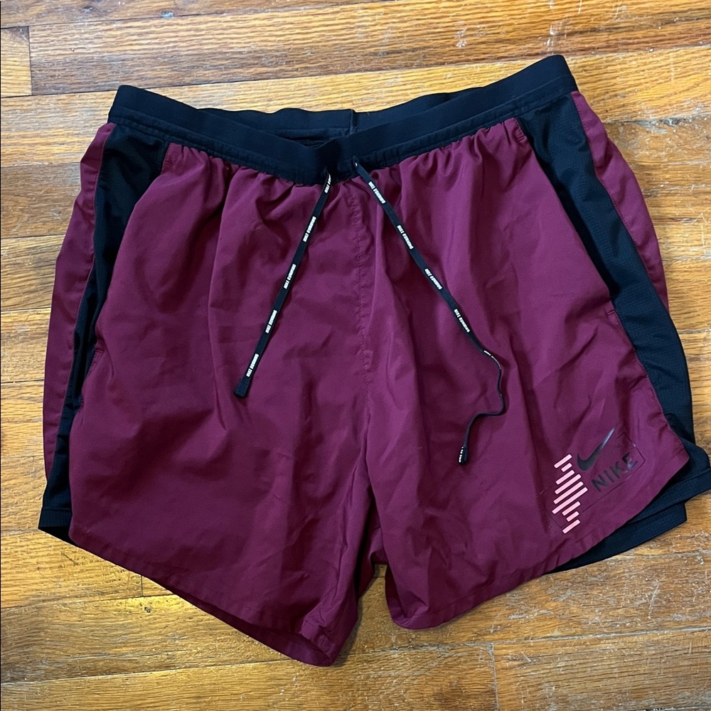 Nike Stride Maroon Running Shorts with Black Trim.